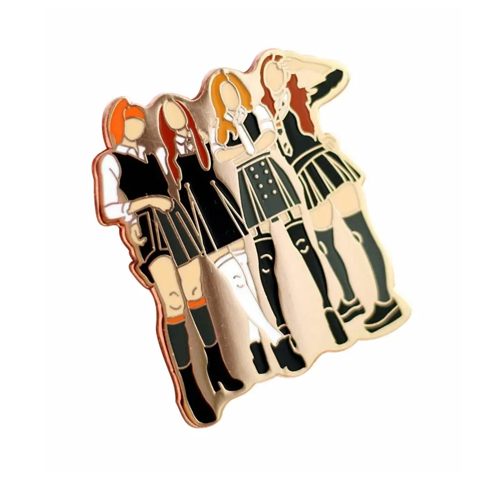 A pin badge depicting four female anime characters in schoolgirl uniforms