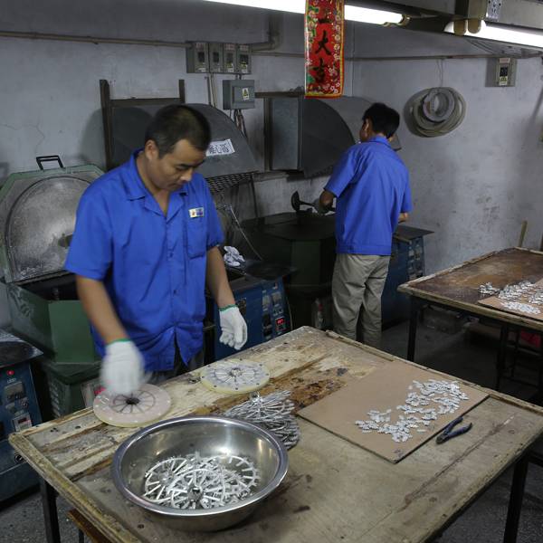 Spin casting process shown in the workshop environment.