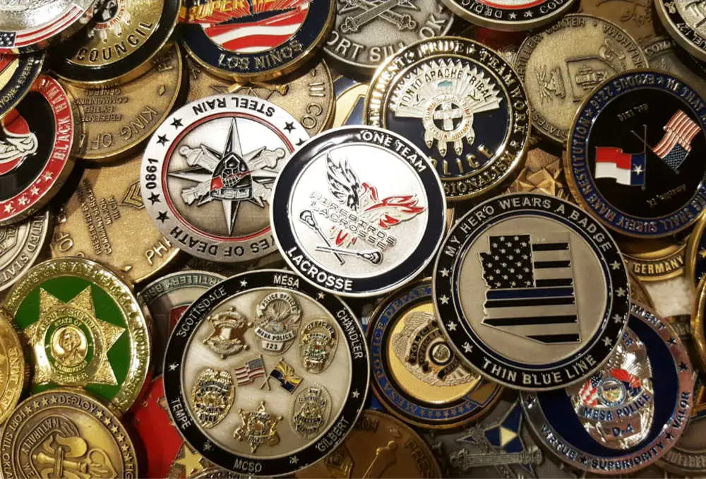 A collection of diverse challenge coins from law enforcement and military organizations
