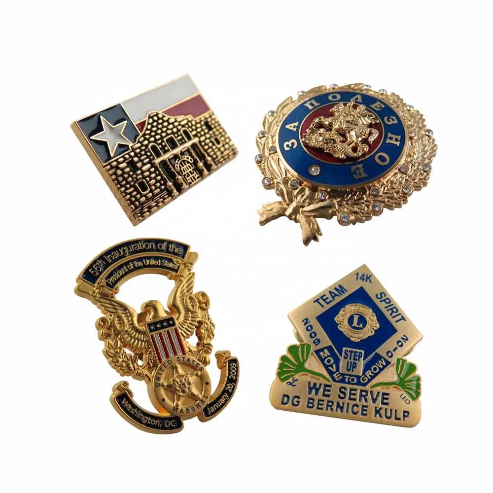 Four commemorative pins or badges for official events or organizations