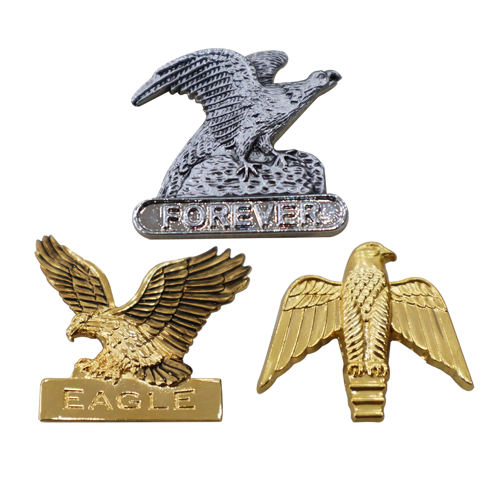 A collection of eagle-themed metal pins demonstrating the no-coloring craft