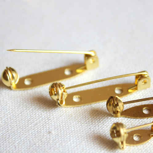 Gold safety pin style lapel pin backs