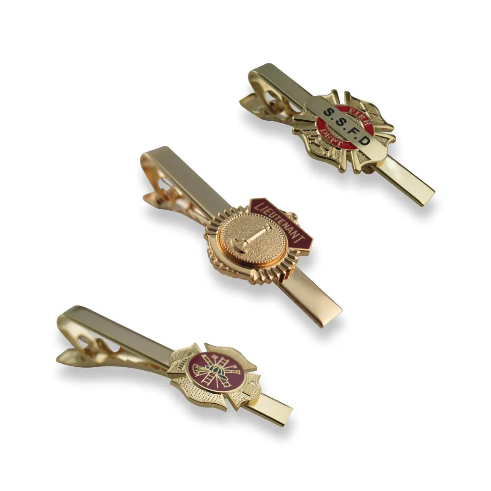 Three gold tie clips with SSFD and Lieutenant designs, perfect for uniforms.