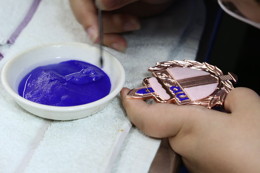 Detailed enamel coloring process for custom pins