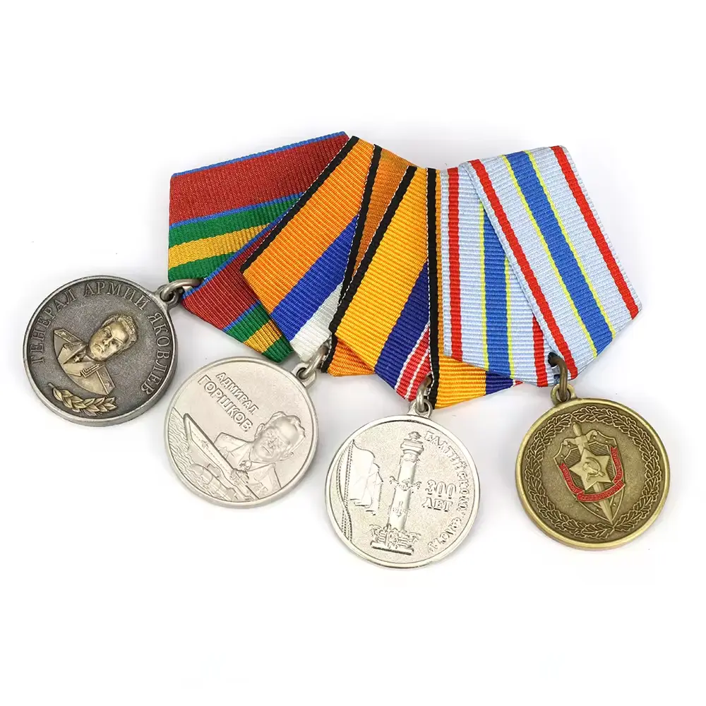 A collection of four custom military medals attached to a decorative ribbon