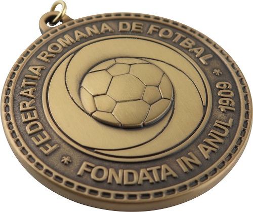 A vintage-style medal from the Romanian Football Federation, established in 1909.