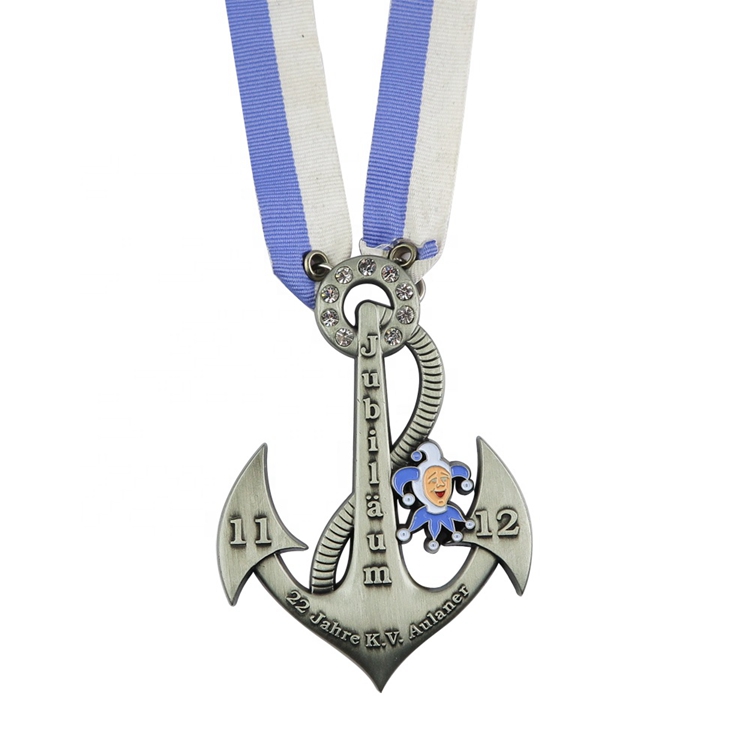 A commemorative silver anchor pendant for a 22-year anniversary of 'K.V. Aulaner'.