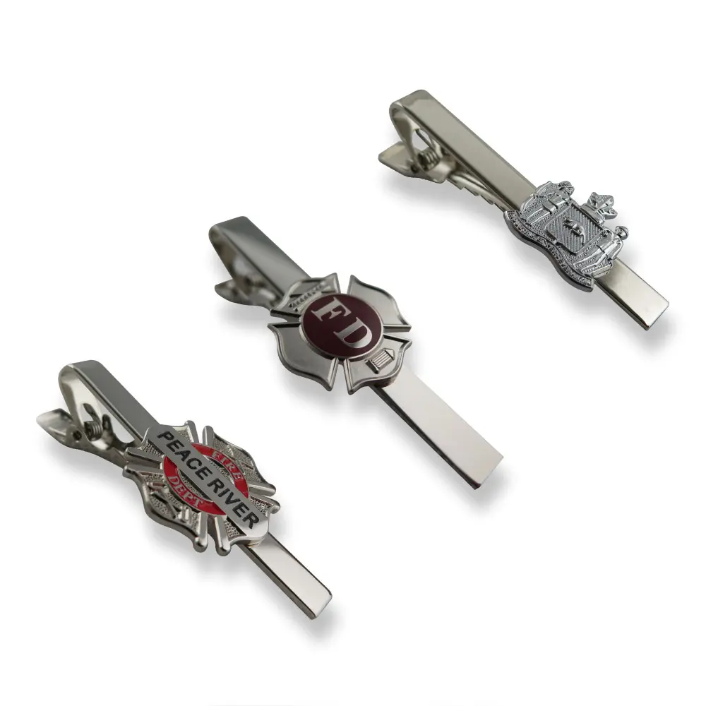 A collection of modern designer silver tie clips with unique designs.