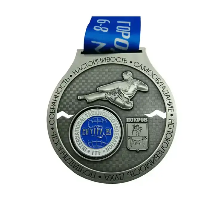 A custom silver taekwondo medal from the International Taekwon-Do Federation